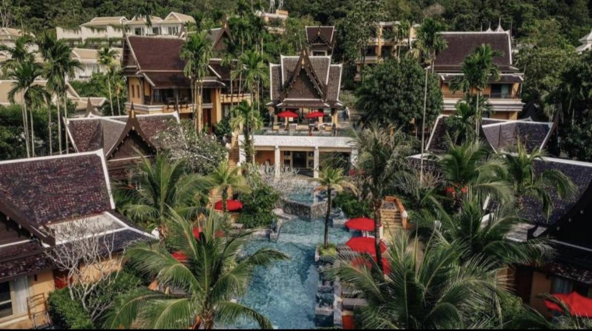 Ultra-luxury Thai-architecture villa resort with swimming pool and traditional roofs.